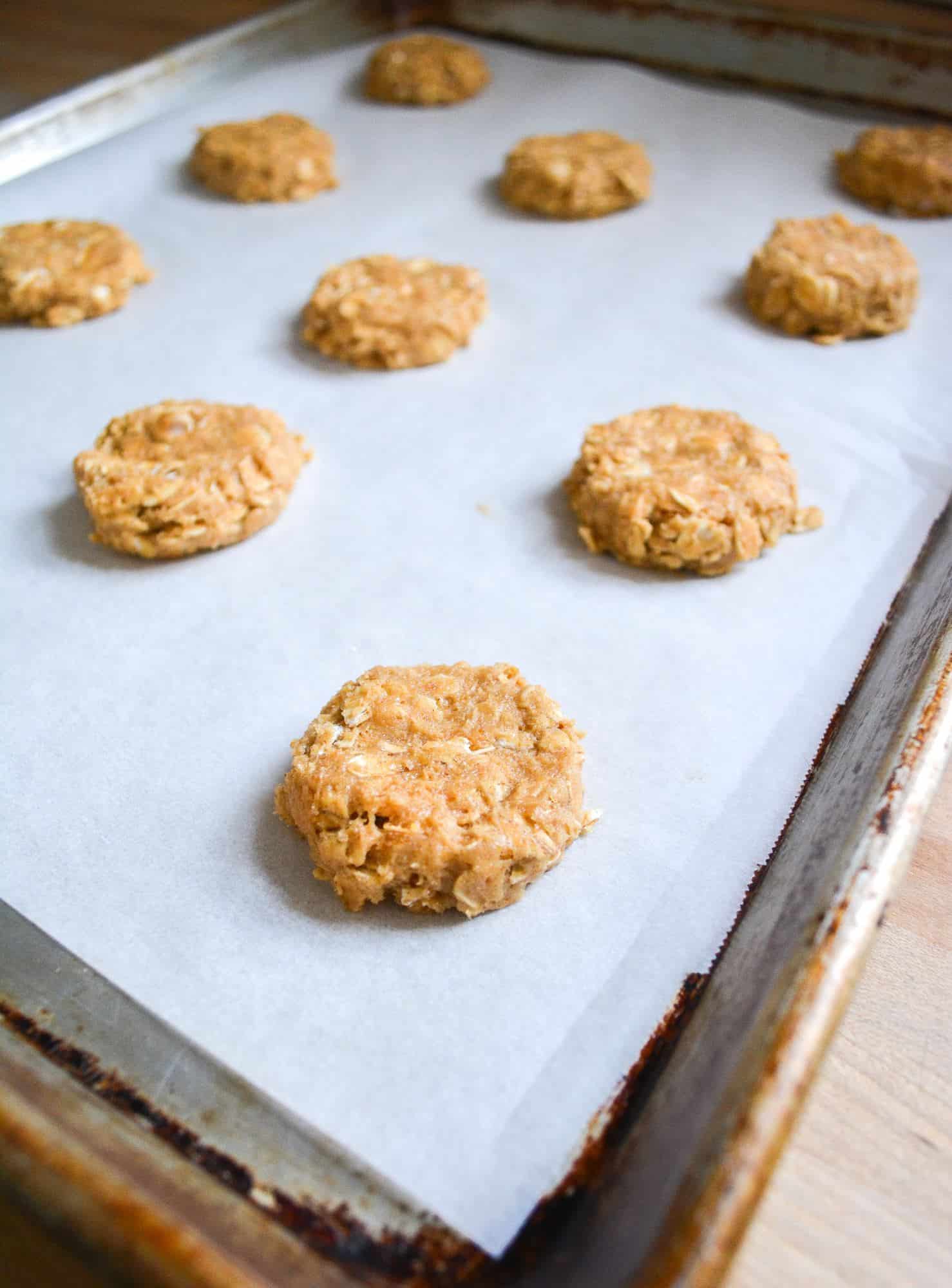 Oatmeal cookies on a sheet ready to be baked