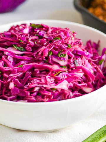 Cilantro Lime Red Cabbage Slaw in a white bowl