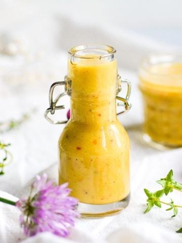 Vegan Honey Mustard Dressing in a small bottle