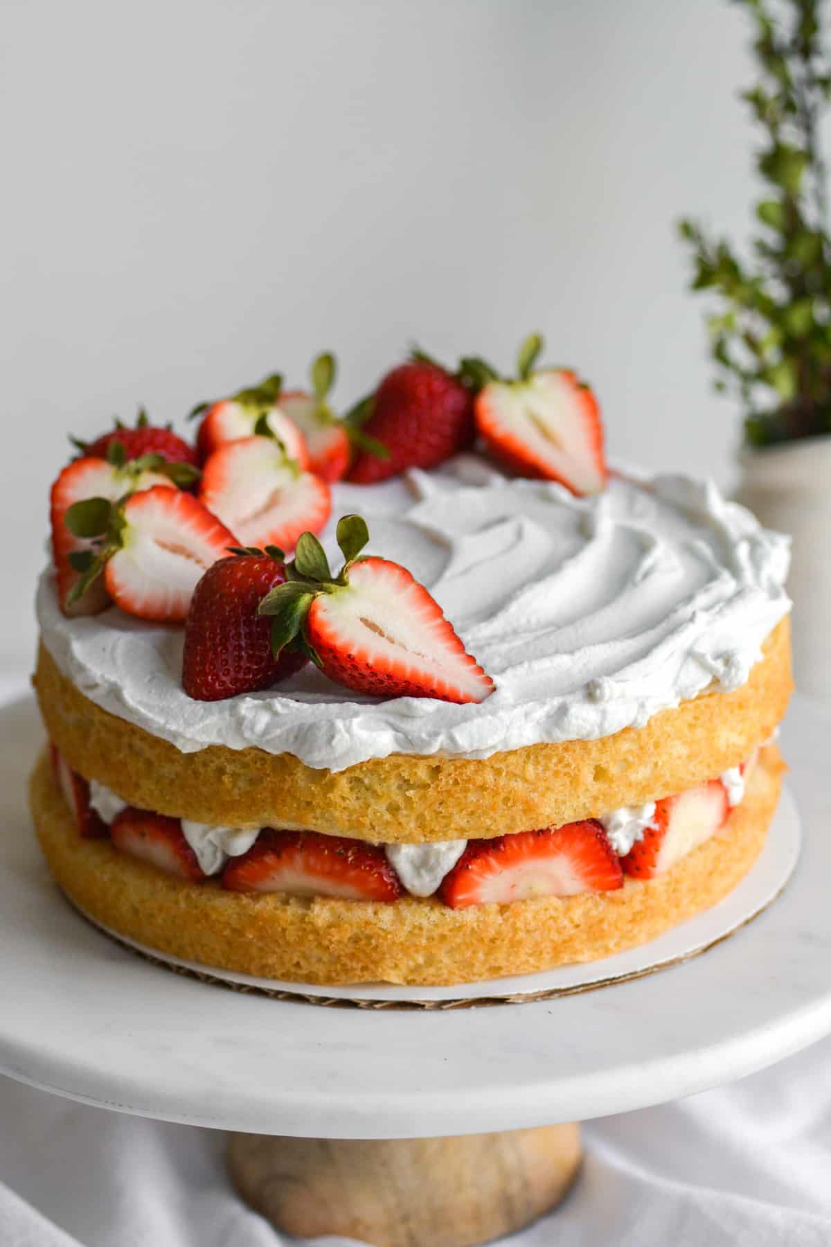 Vegan Strawberry Shortcake Cake on a cake stand