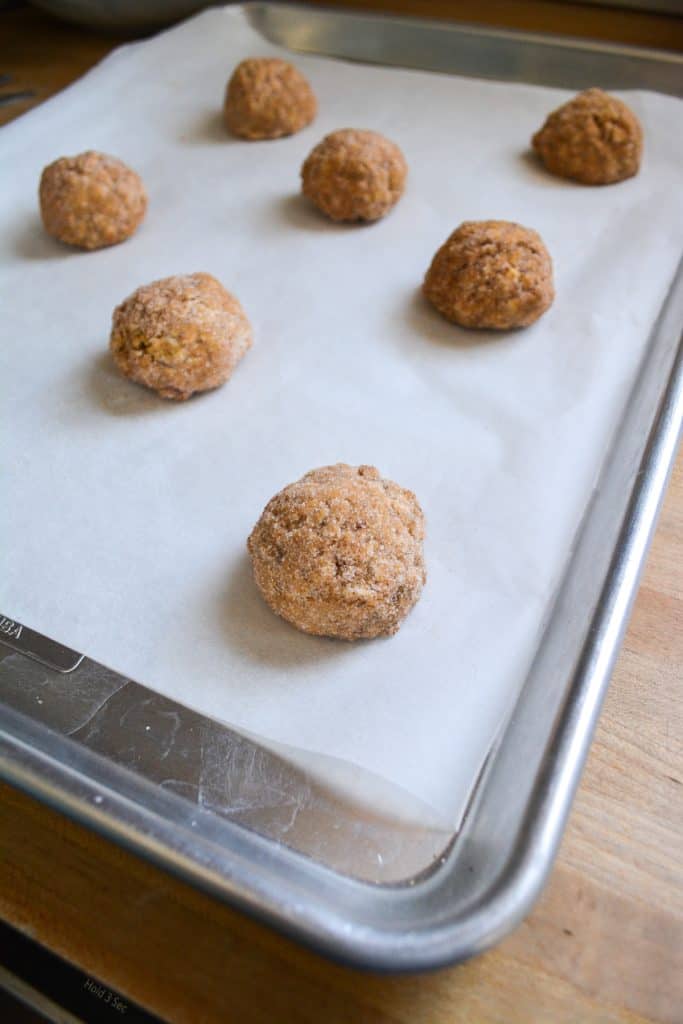unbaked oatmeal snickerdoodles on a baking sheet