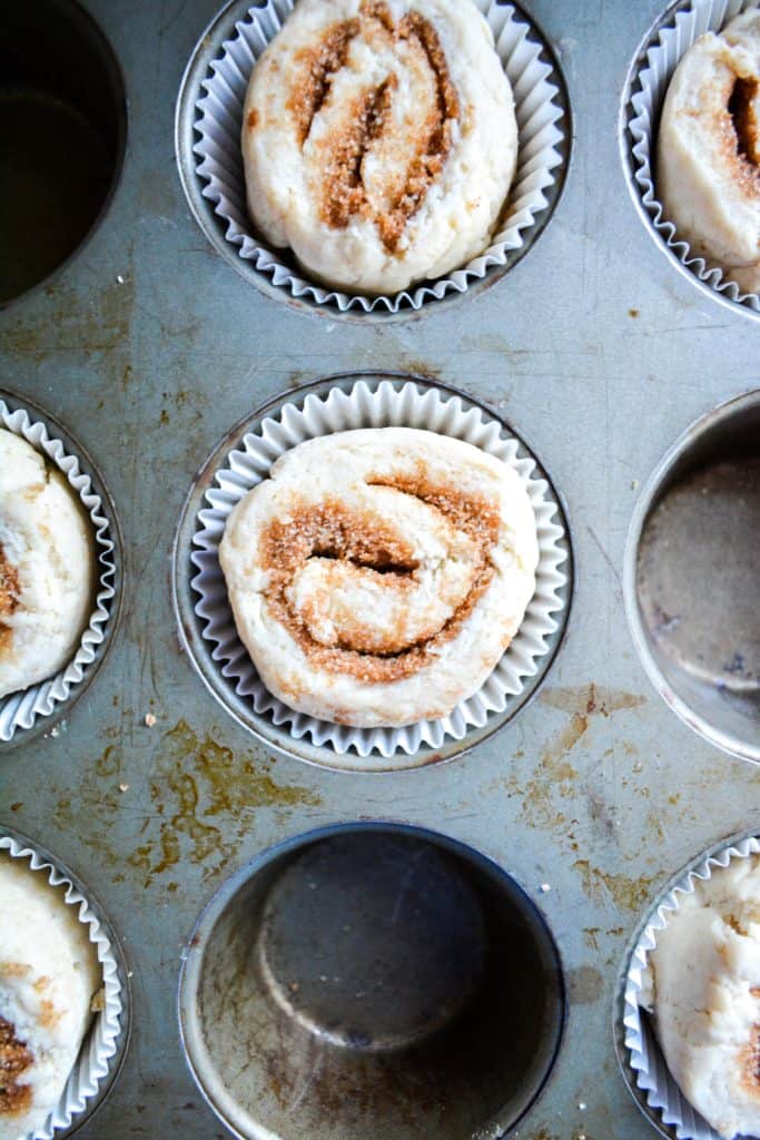 cinnamon roll muffins in a muffin pan