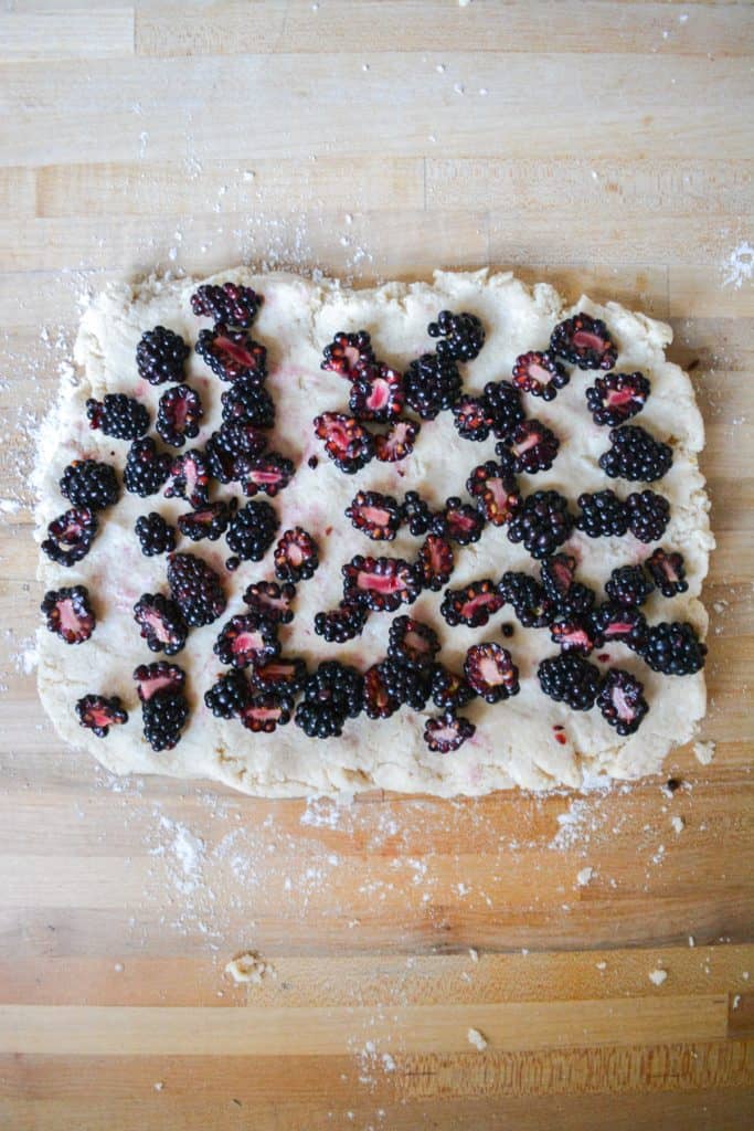 Blackberries distributed on top of a dough rectangle