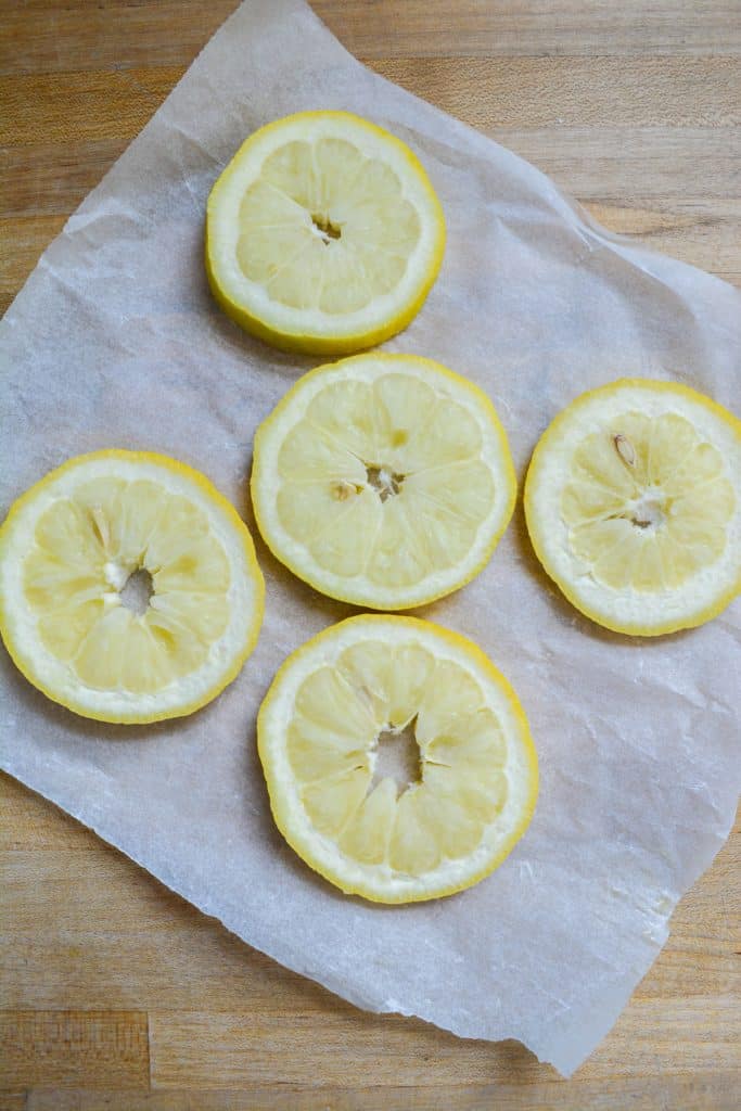 Frozen lemons on a piece of parchment