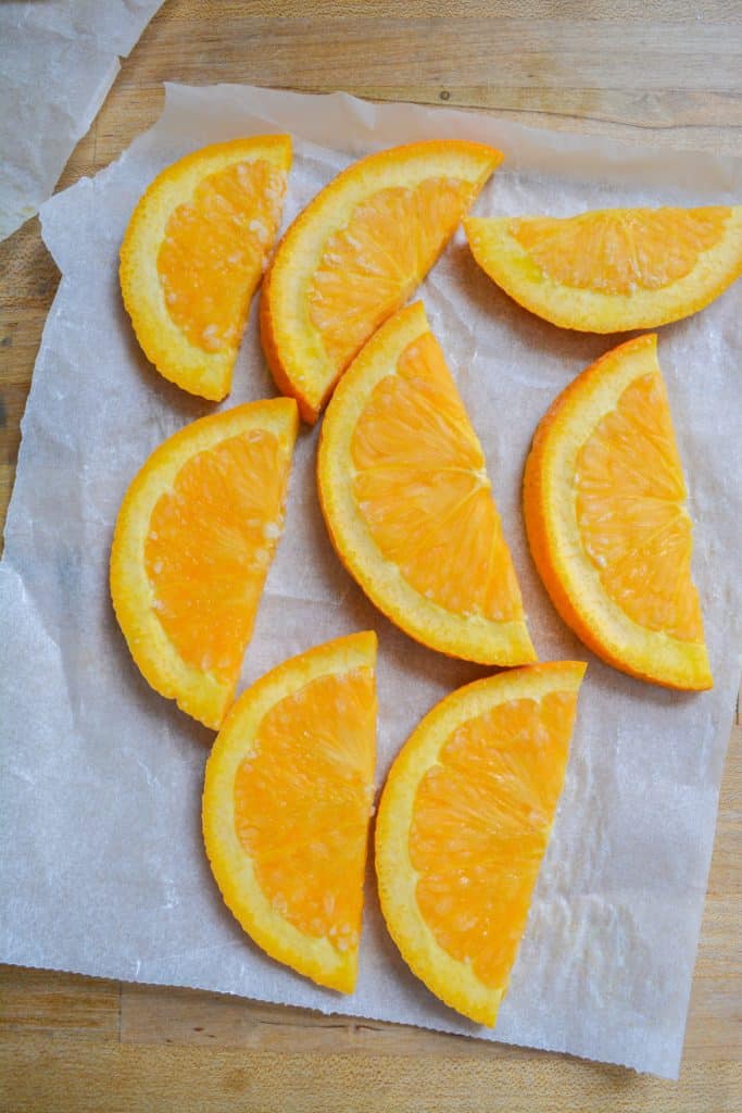 Frozen oranges on a piece of parchment
