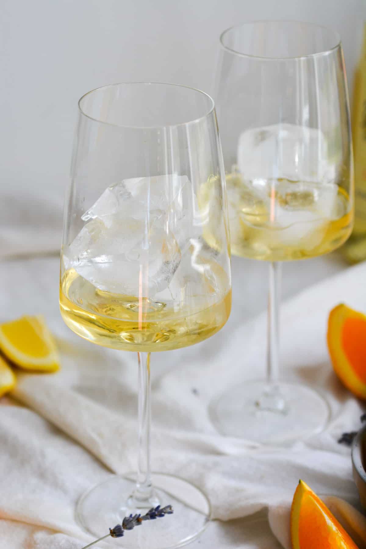 Lillet in a wine glass with ice cubes