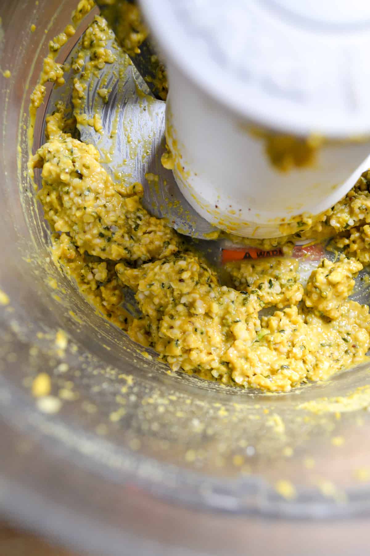 the hemp seeds, lemon juice, garlic and nutritional yeast pulsed up into a paste in a food processor.