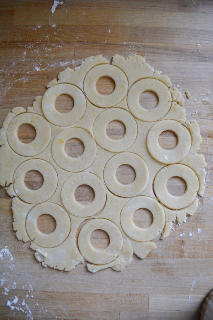 Cookie tops cut out of the rolled out dough.