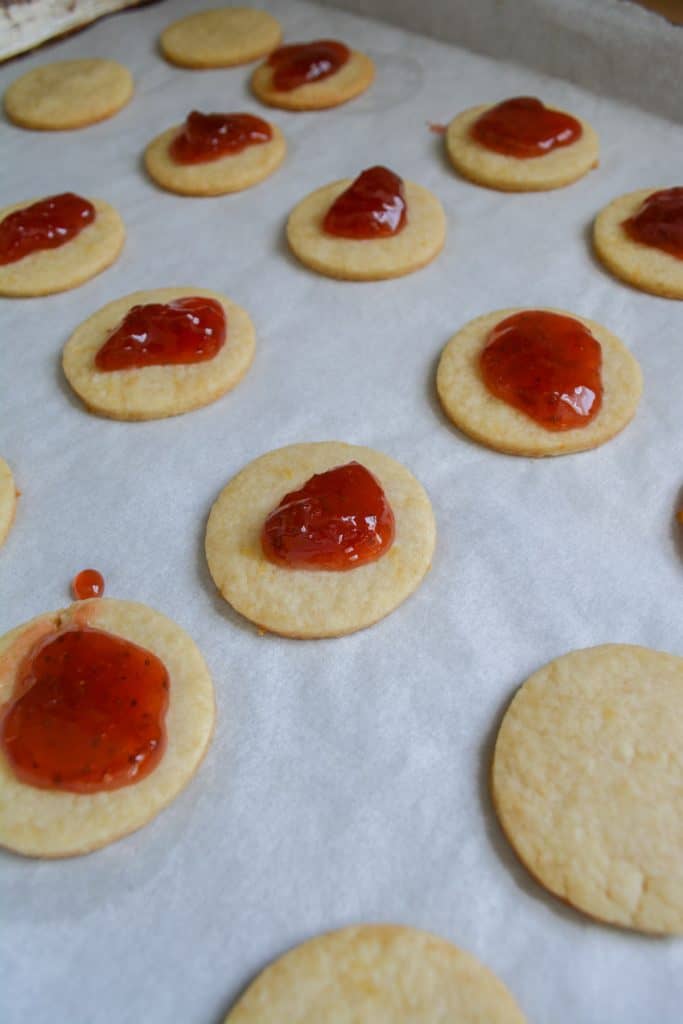 Strawberry Jam on top of the baked cookie bottoms