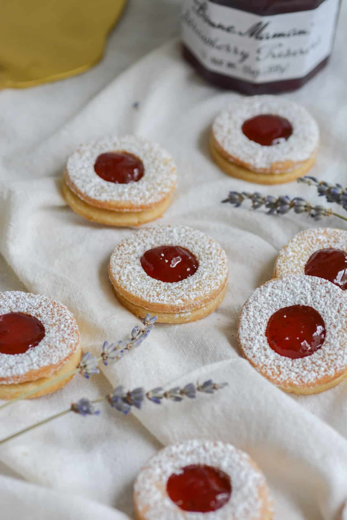 Vegan Strawberry Jam Linzer Cookies on a white cloth
