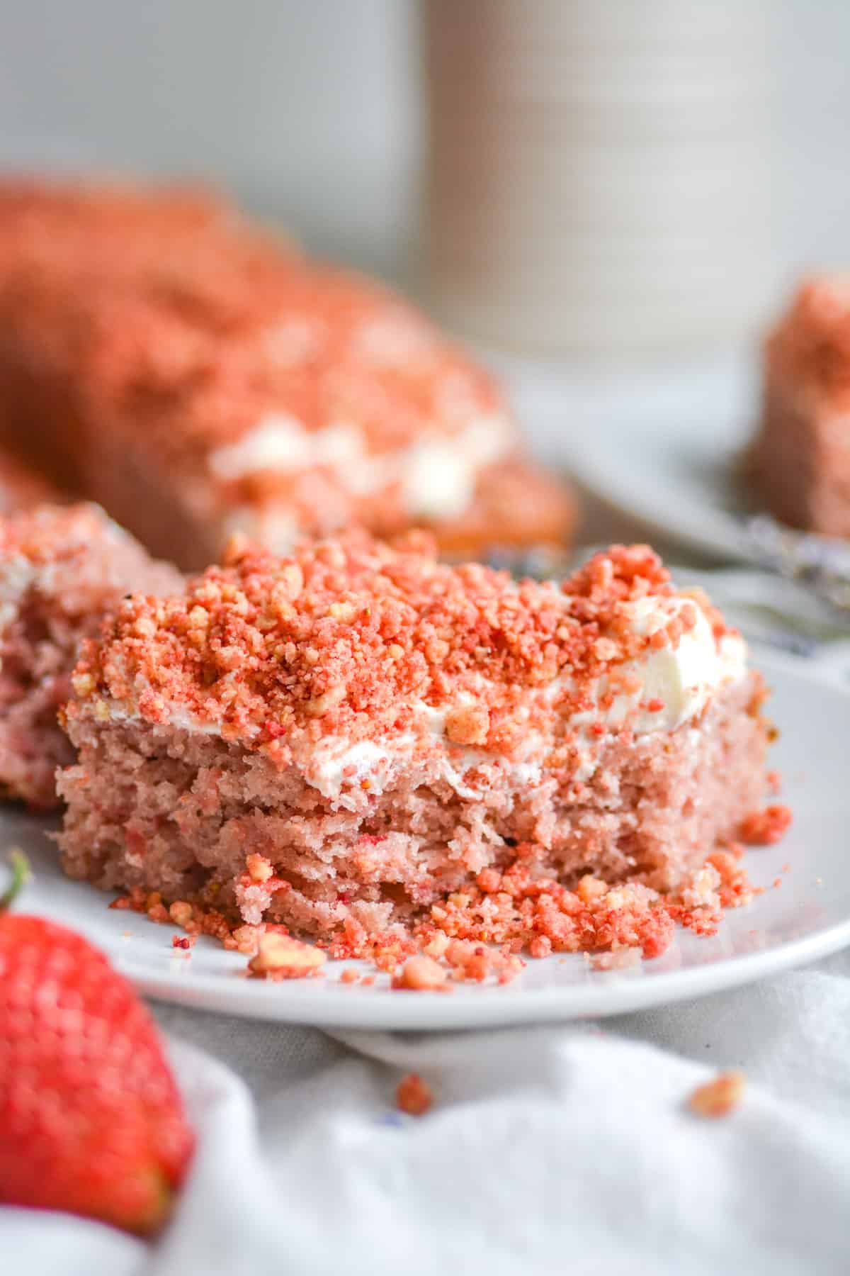 Easy Vegan Strawberry Crunch Cake with a bite taken out of it.