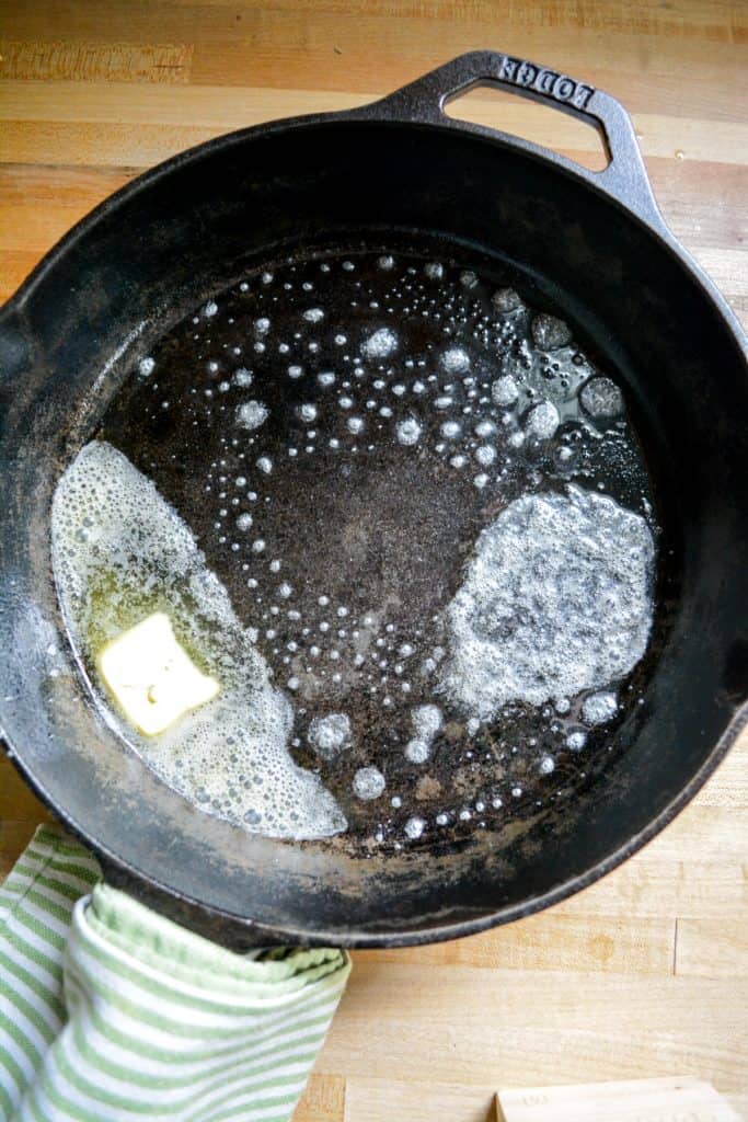 vegan butter melting a hot cast iron skillet