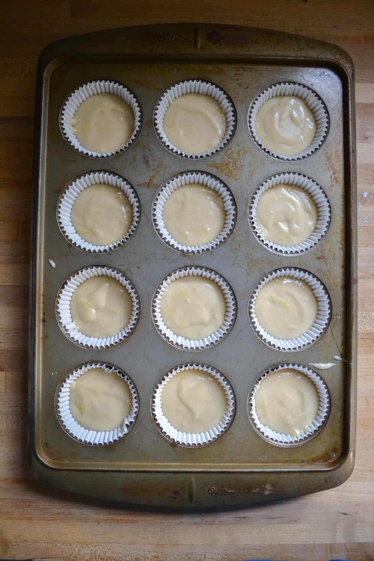 Batter in a cupcake tin ready to be baked