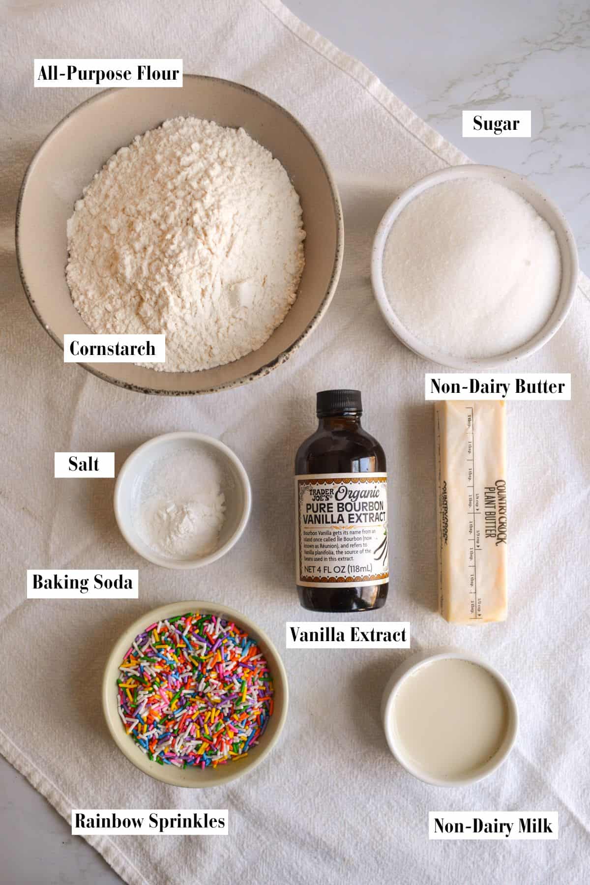Ingredients for making this recipe in small bowls on a linen cloth.
