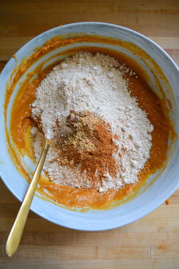 Adding the oat flour and spices into the gluten-free eggless blondie batter