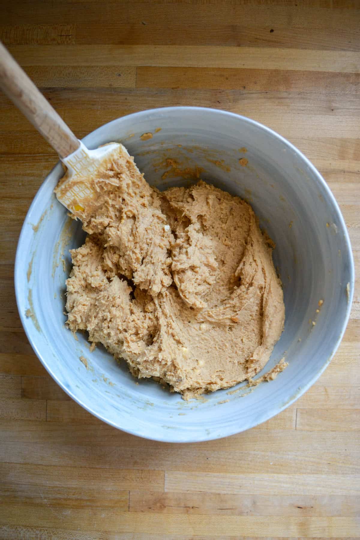 Cookie dough in a large mixing bowl.