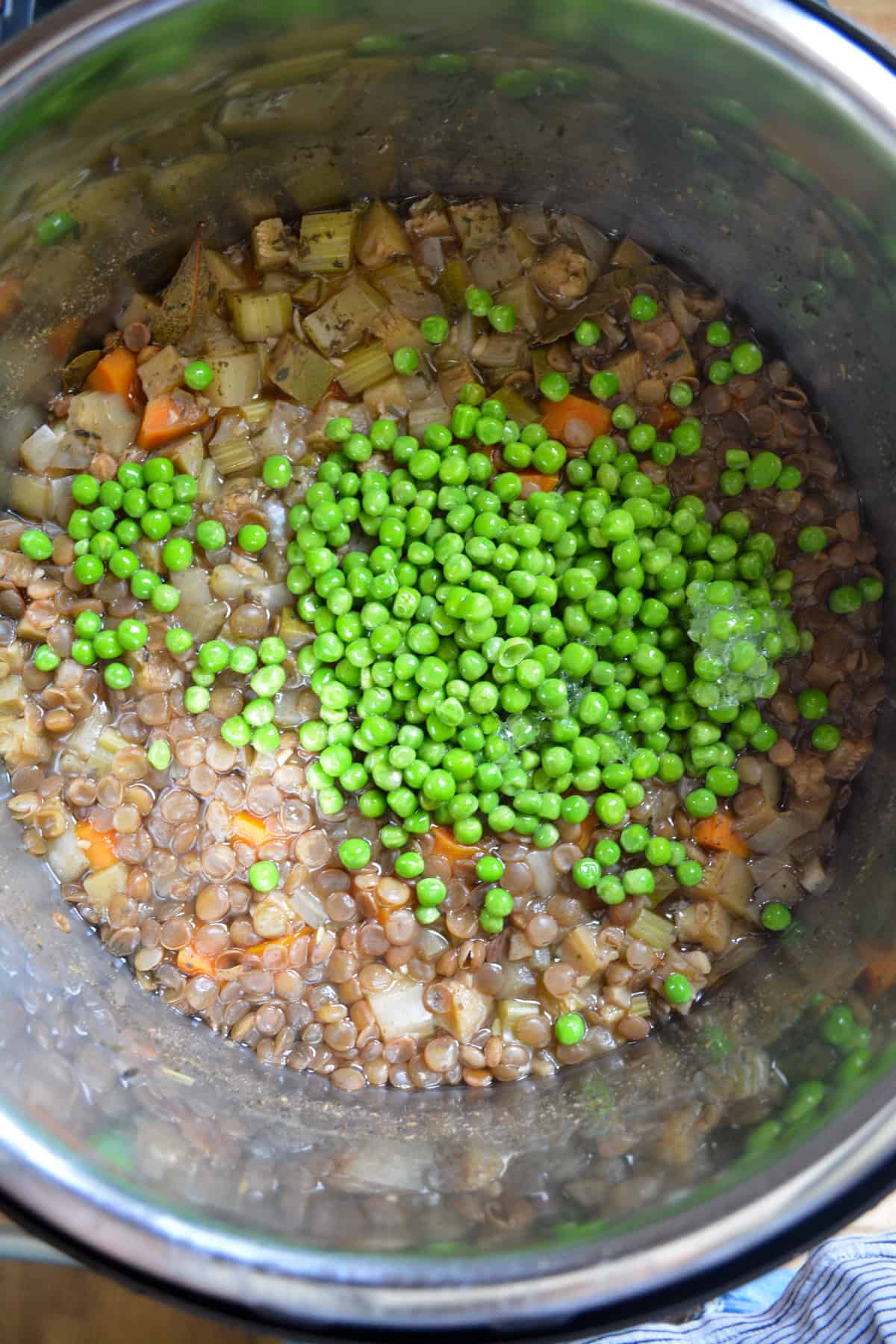 Peas added into the instant pot lentil stew