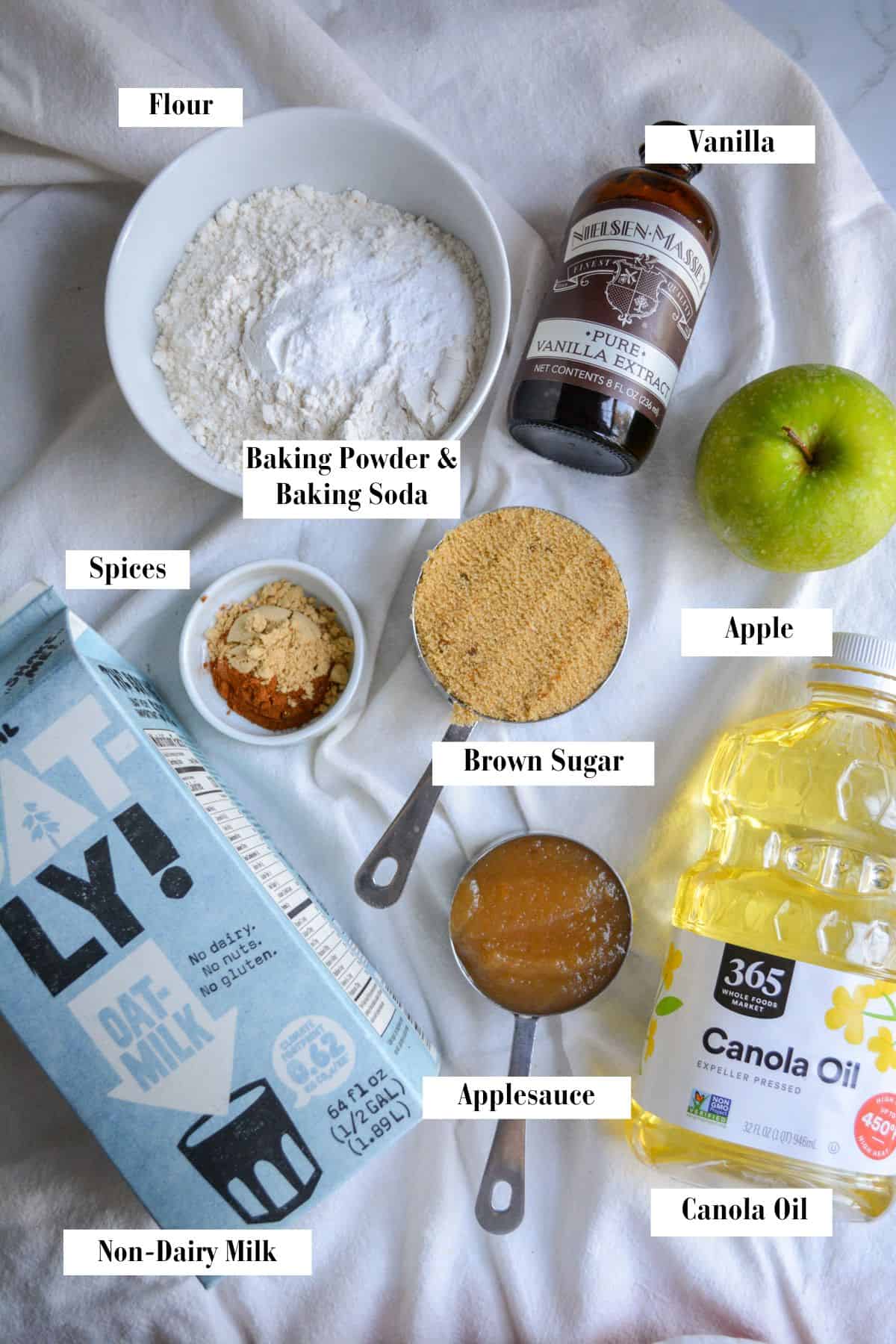 Ingredients for making this recipe in small bowls and measuring cups on a linen cloth.