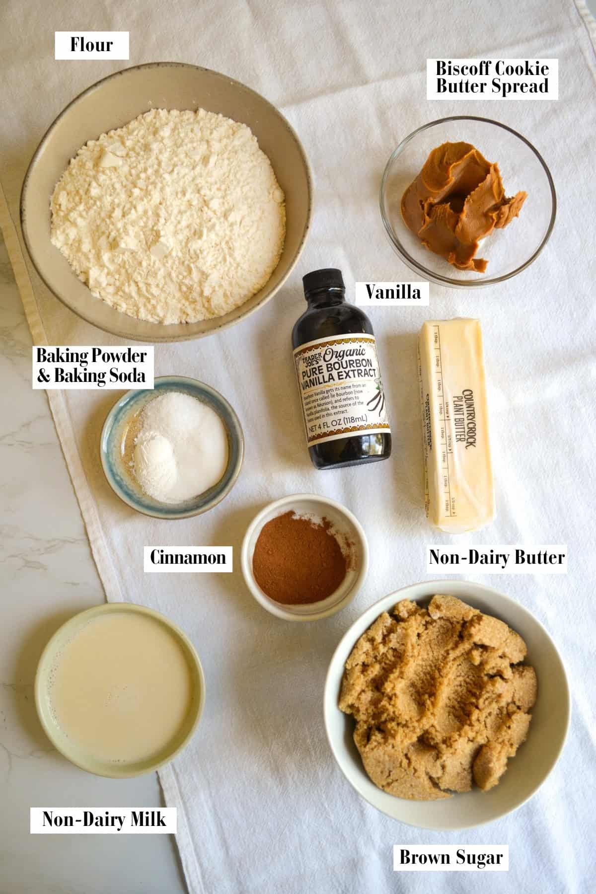 Ingredients for this recipe in small bowls on a linen surface.