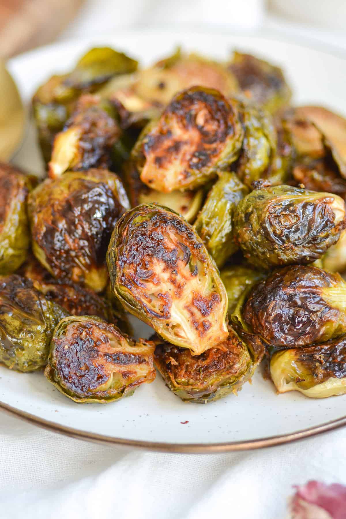 Close up of a plate of Vegan Maple Dijon Mustard Roasted Brussels Sprouts.