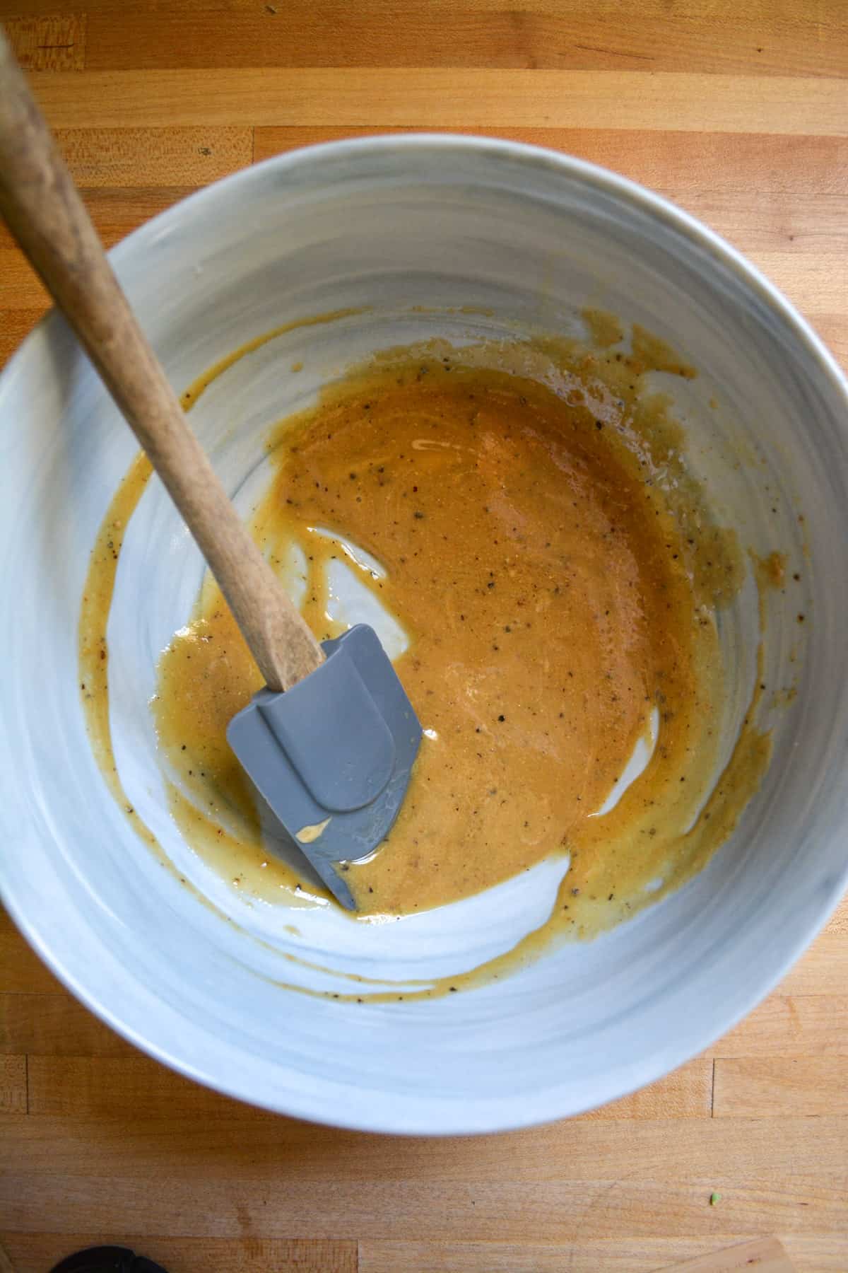 Overhead photo of the maple dijon mustard sauce in a bowl.