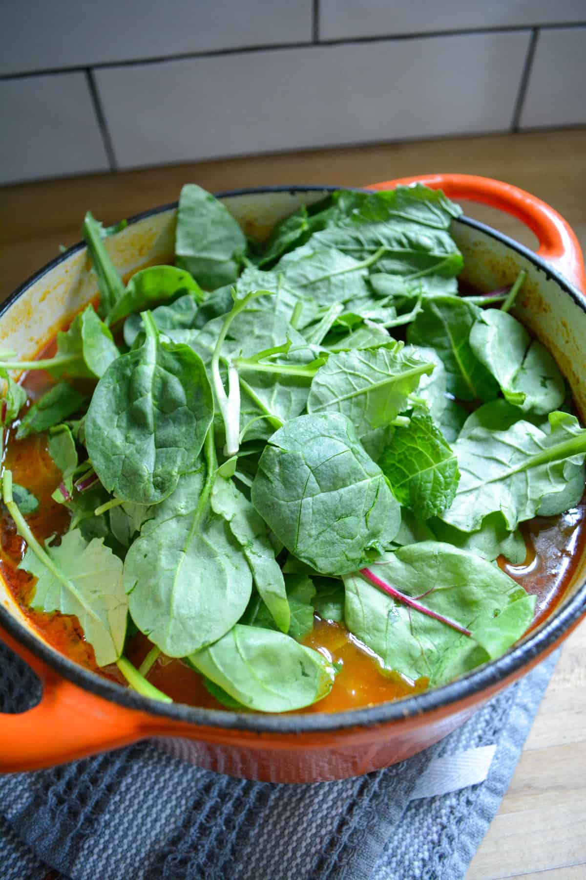 Spinach added into the soup.