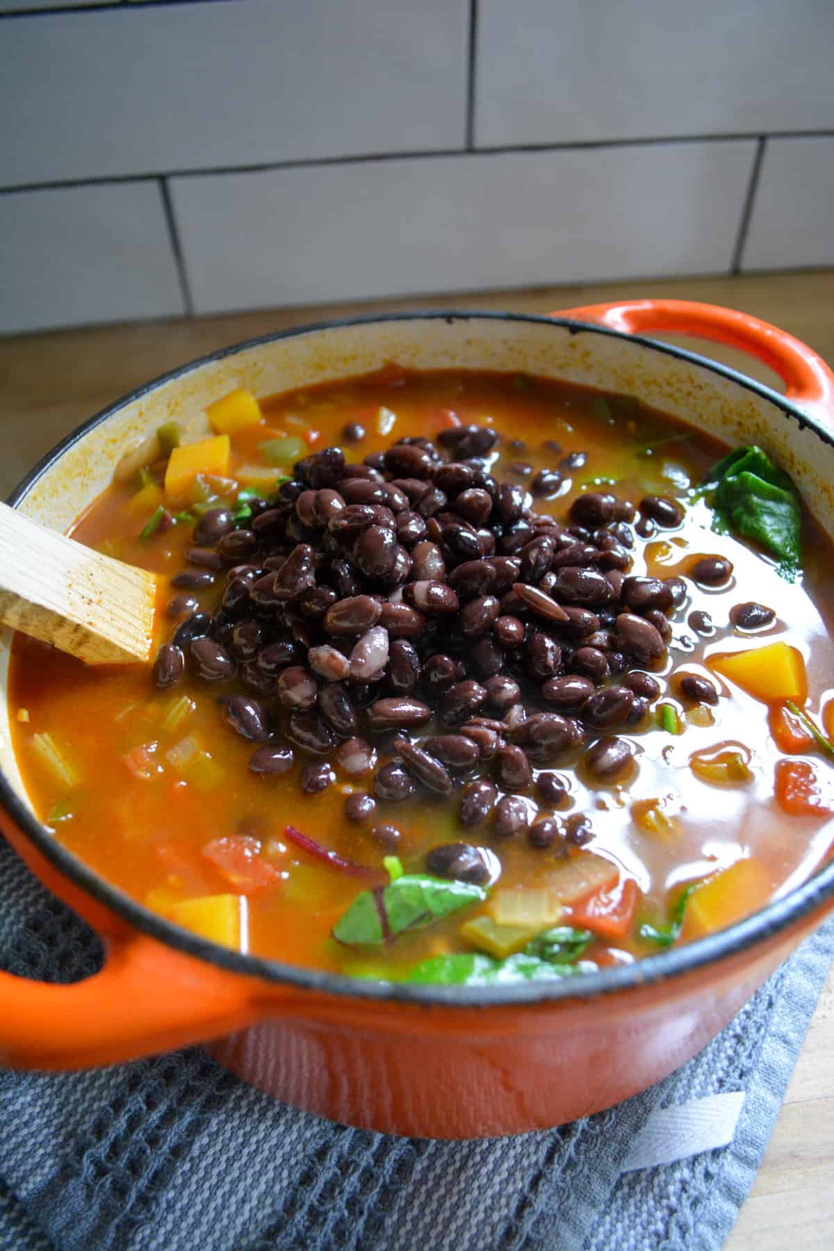 Black beans added into the soup.