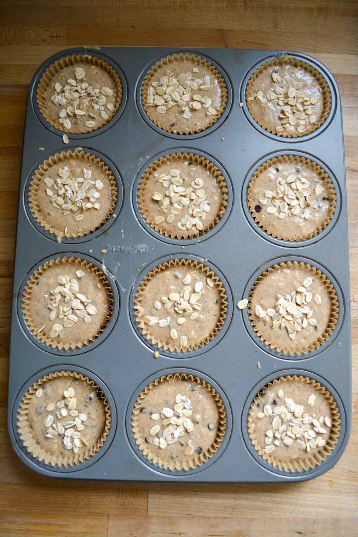 Lined muffin tin filled with batter.