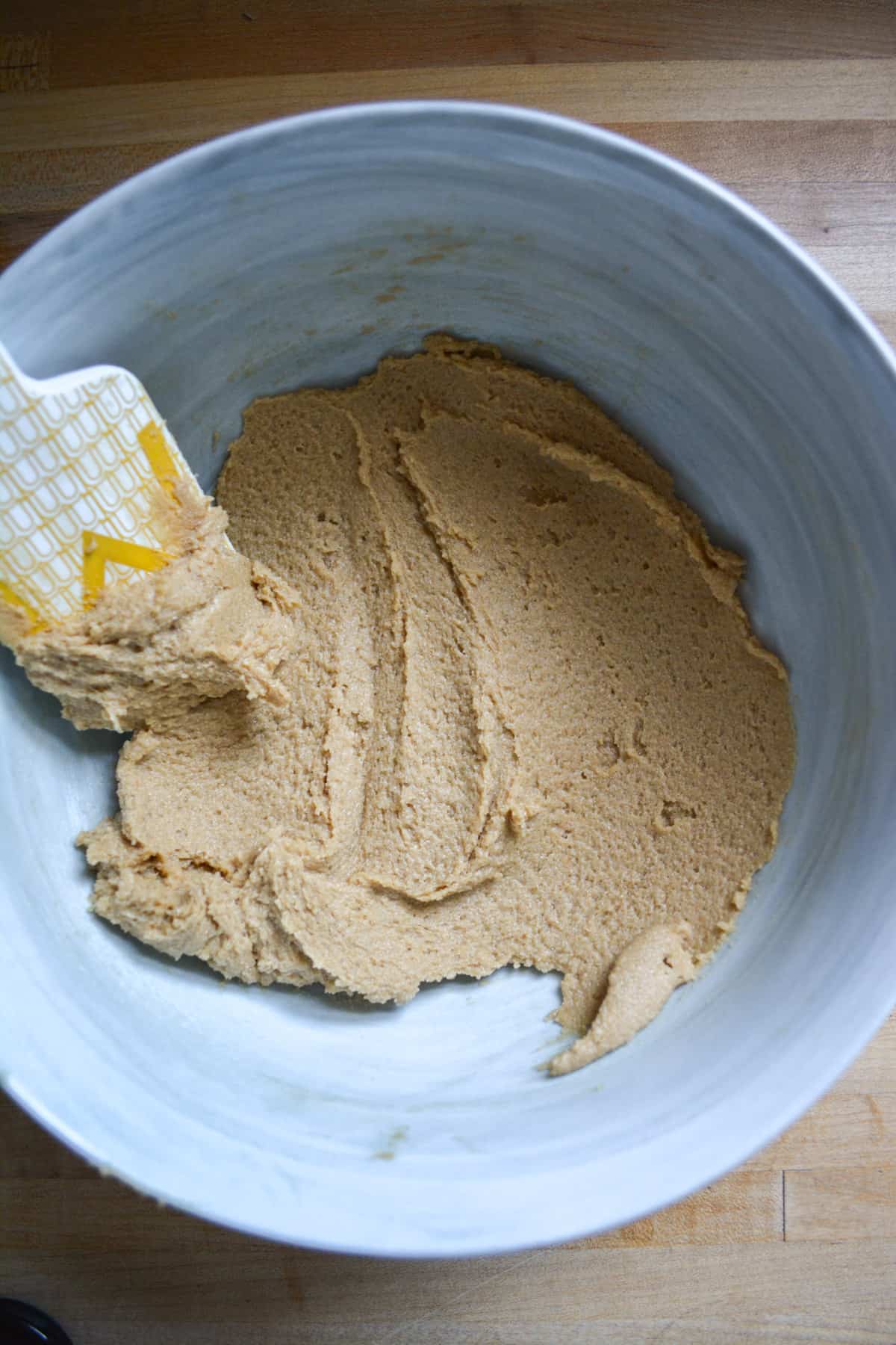 Overhead photo of creamed butter and brown sugar in a bowl.