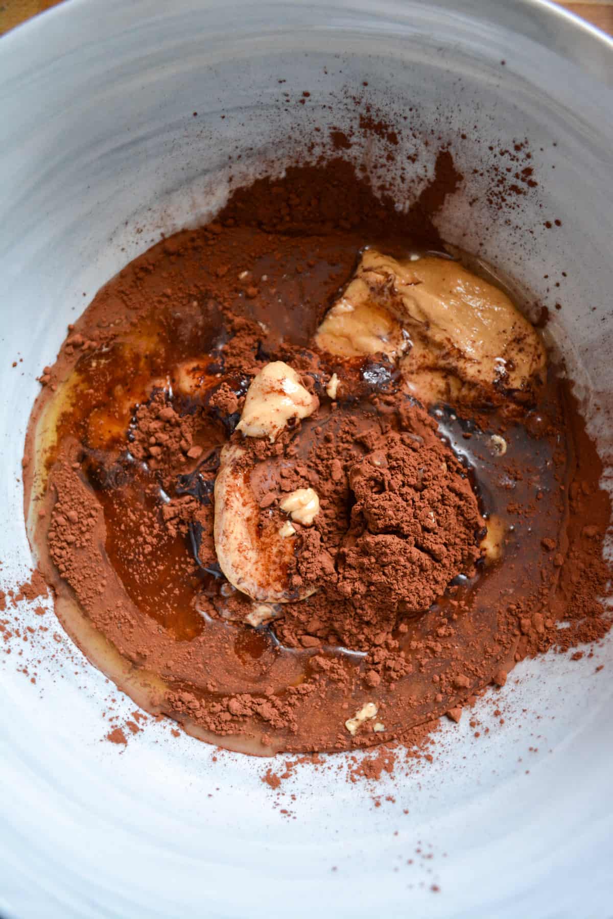 Agave, cocoa powder and peanut butter in a mixing bowl.