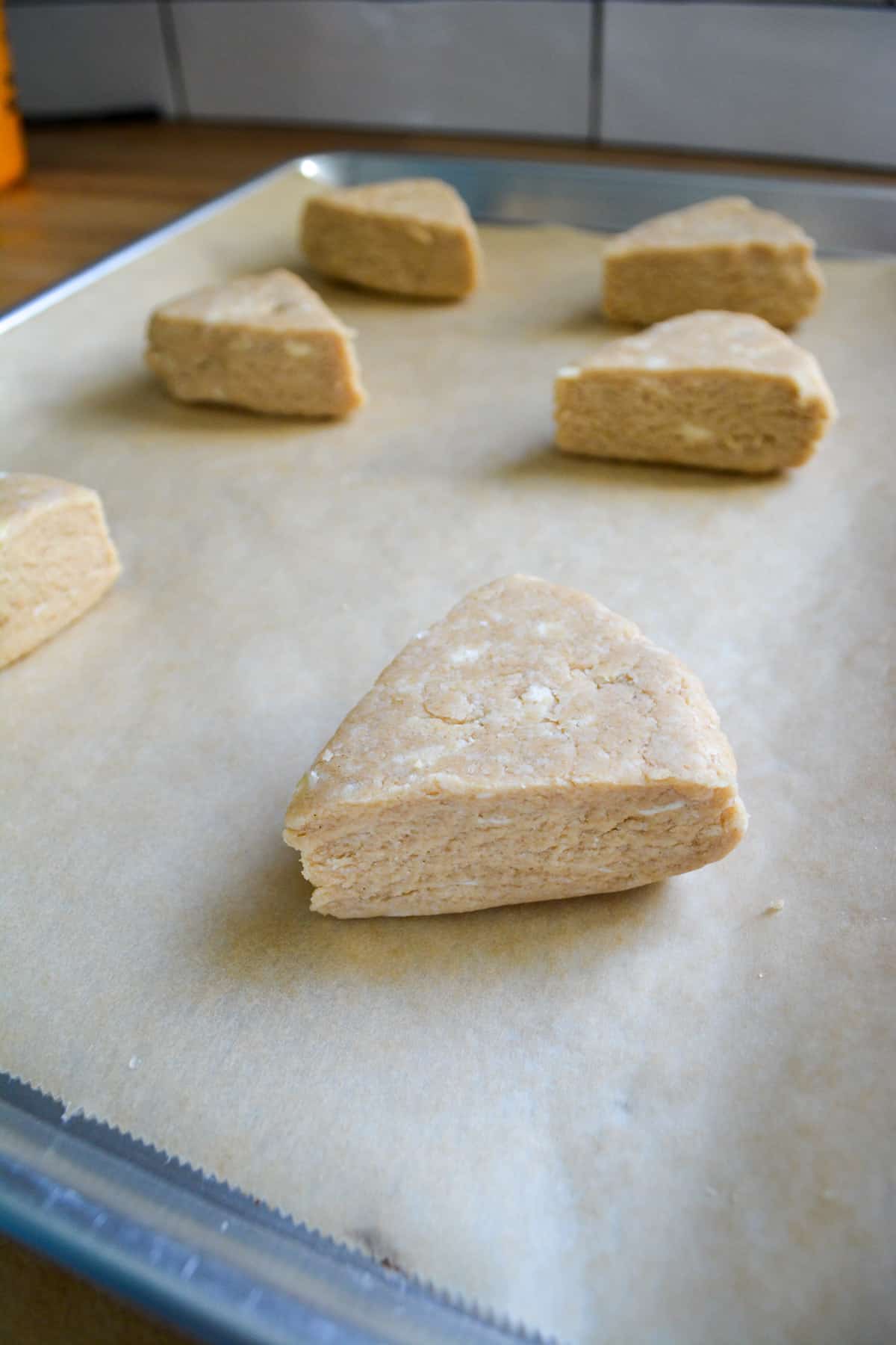 Earl Grey Scones on a parchment lined baking sheet.