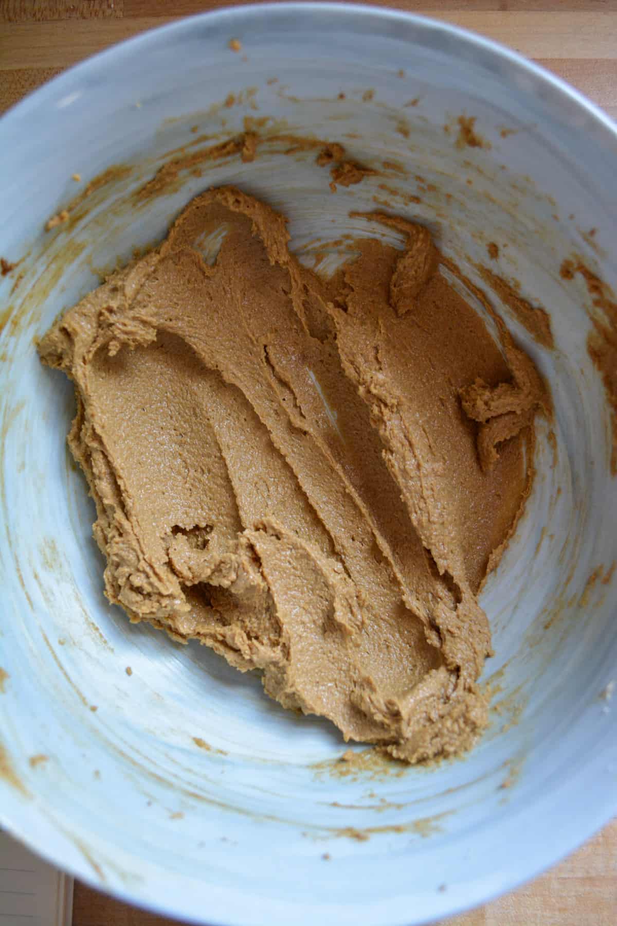Vegan butter, sugar and molasses creamed together in a bowl.