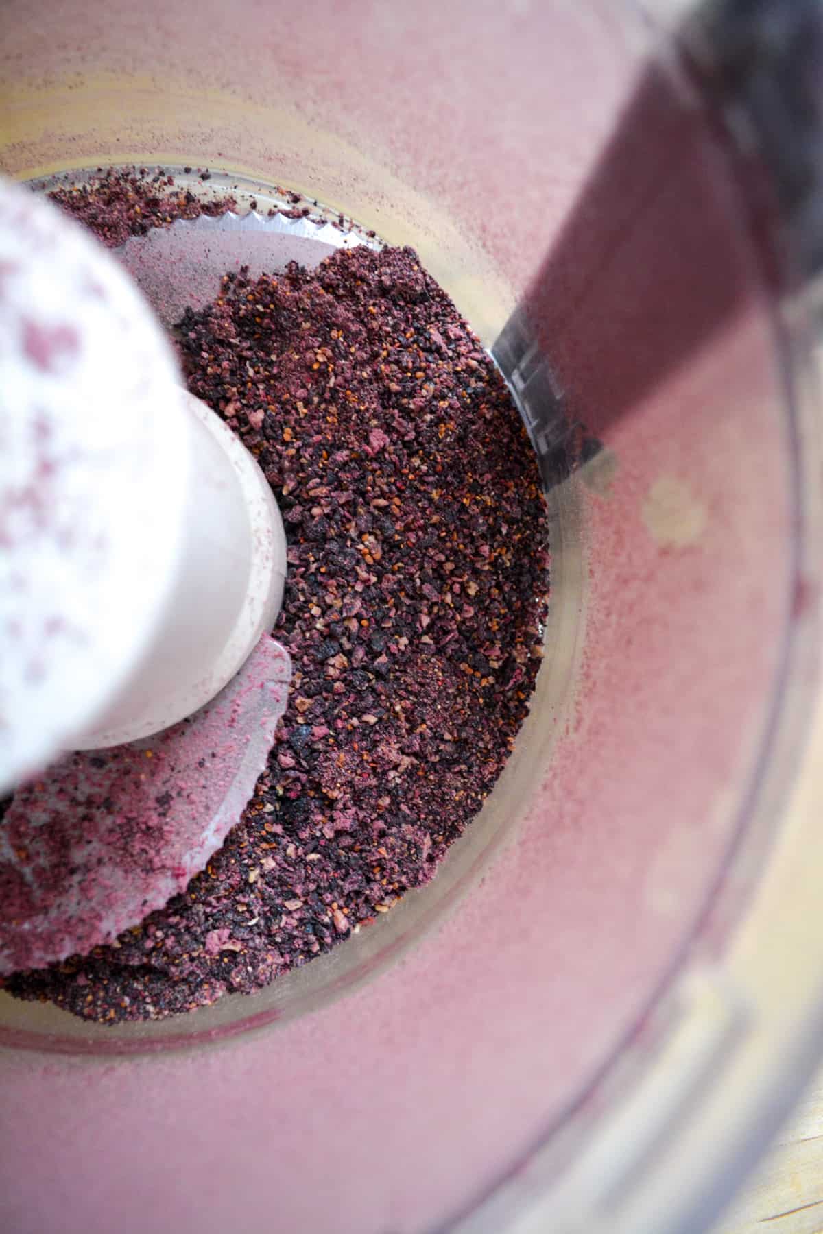 Ground freeze-dried blueberries in a food processor.