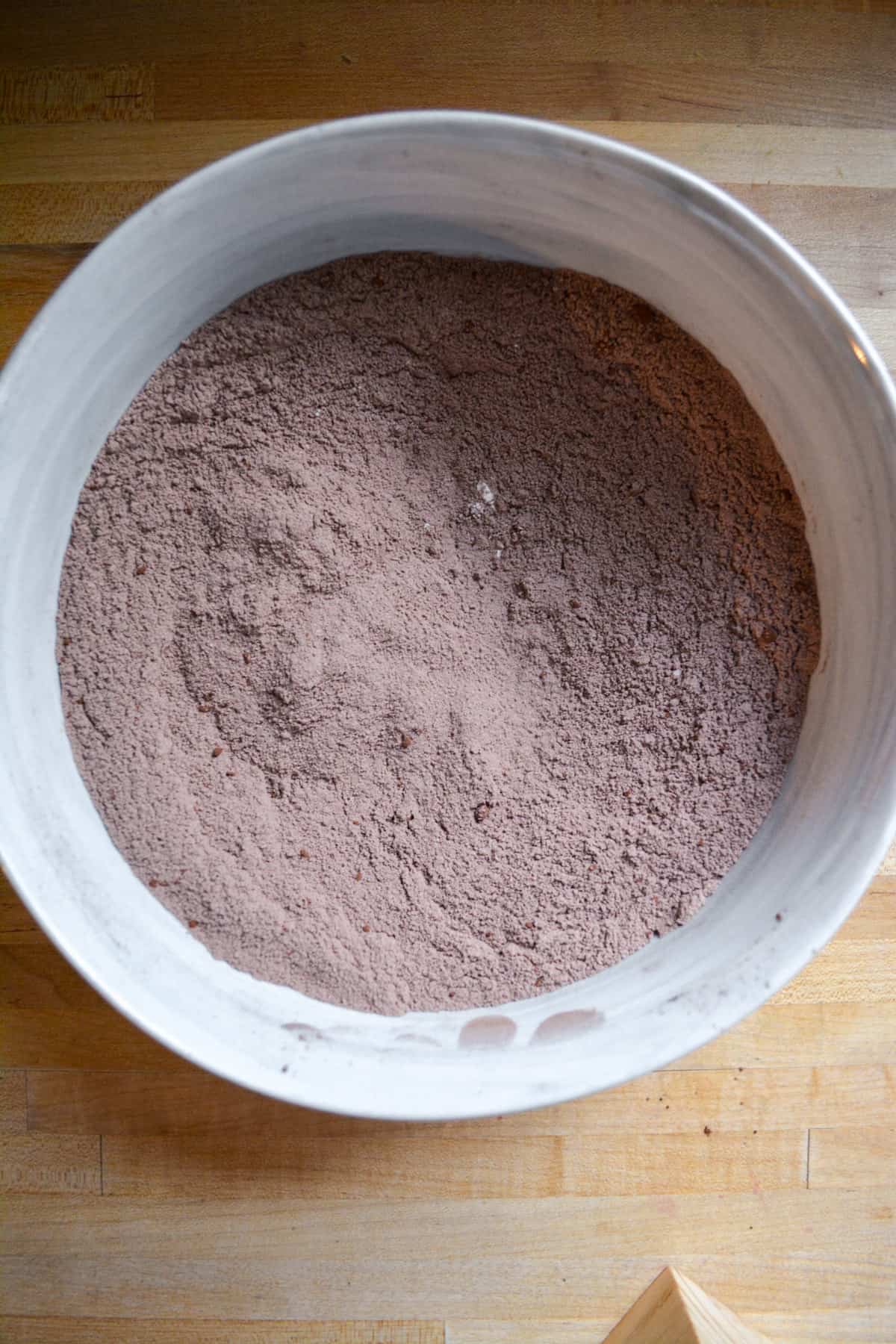 Dry ingredients for the cake mixed together in a large mixing bowl.