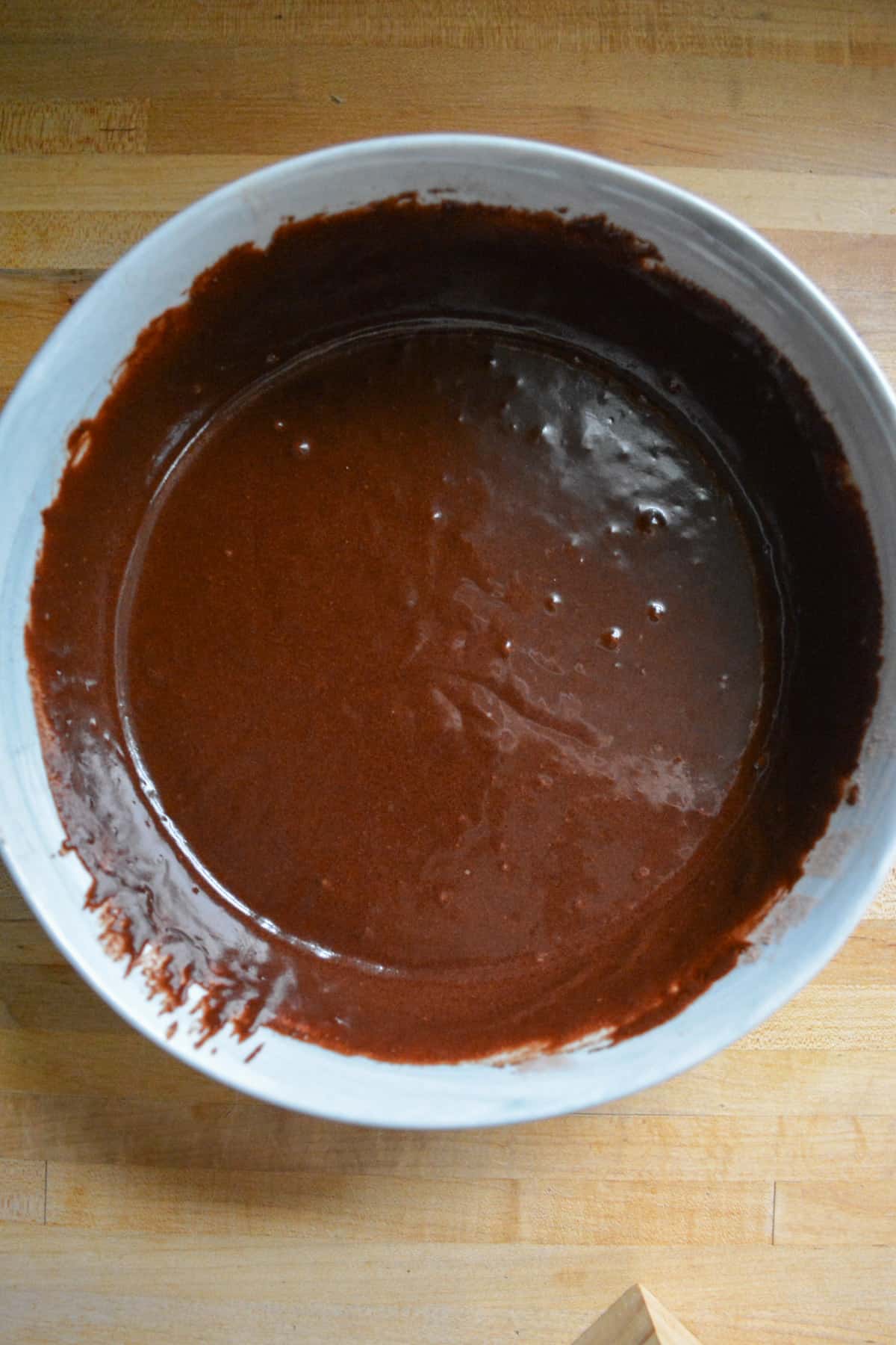 Vegan chocolate cake batter in a mixing bowl.