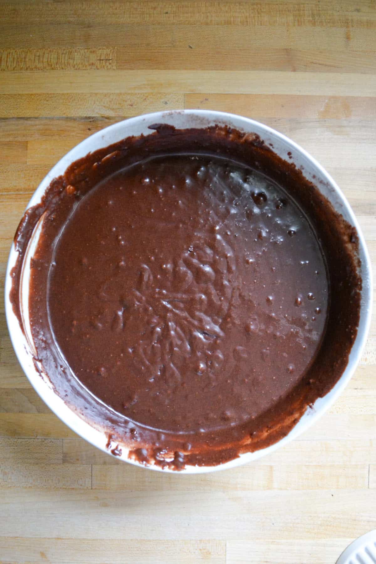 Chocolate cake batter in a large mixing bowl.