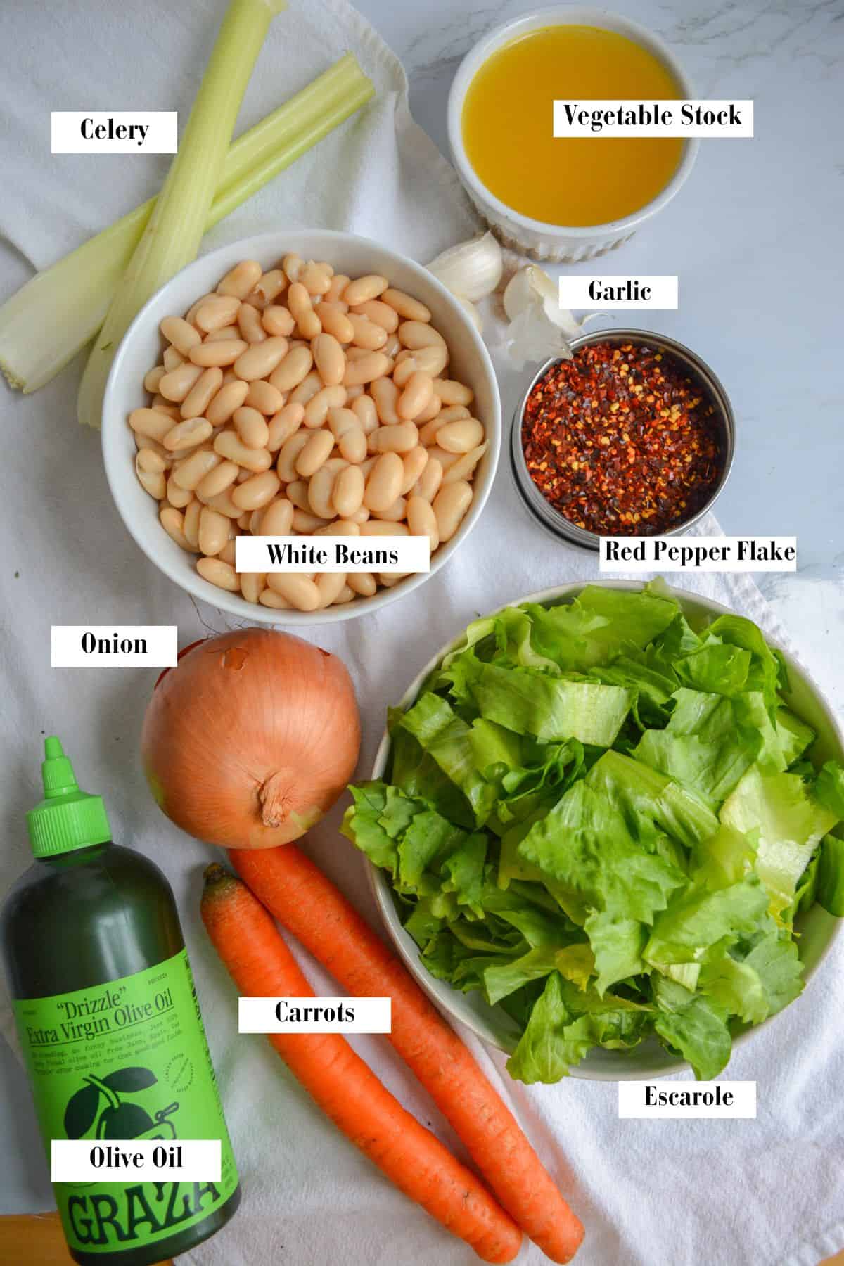 Ingredients needed to make this soup on a marble surface.