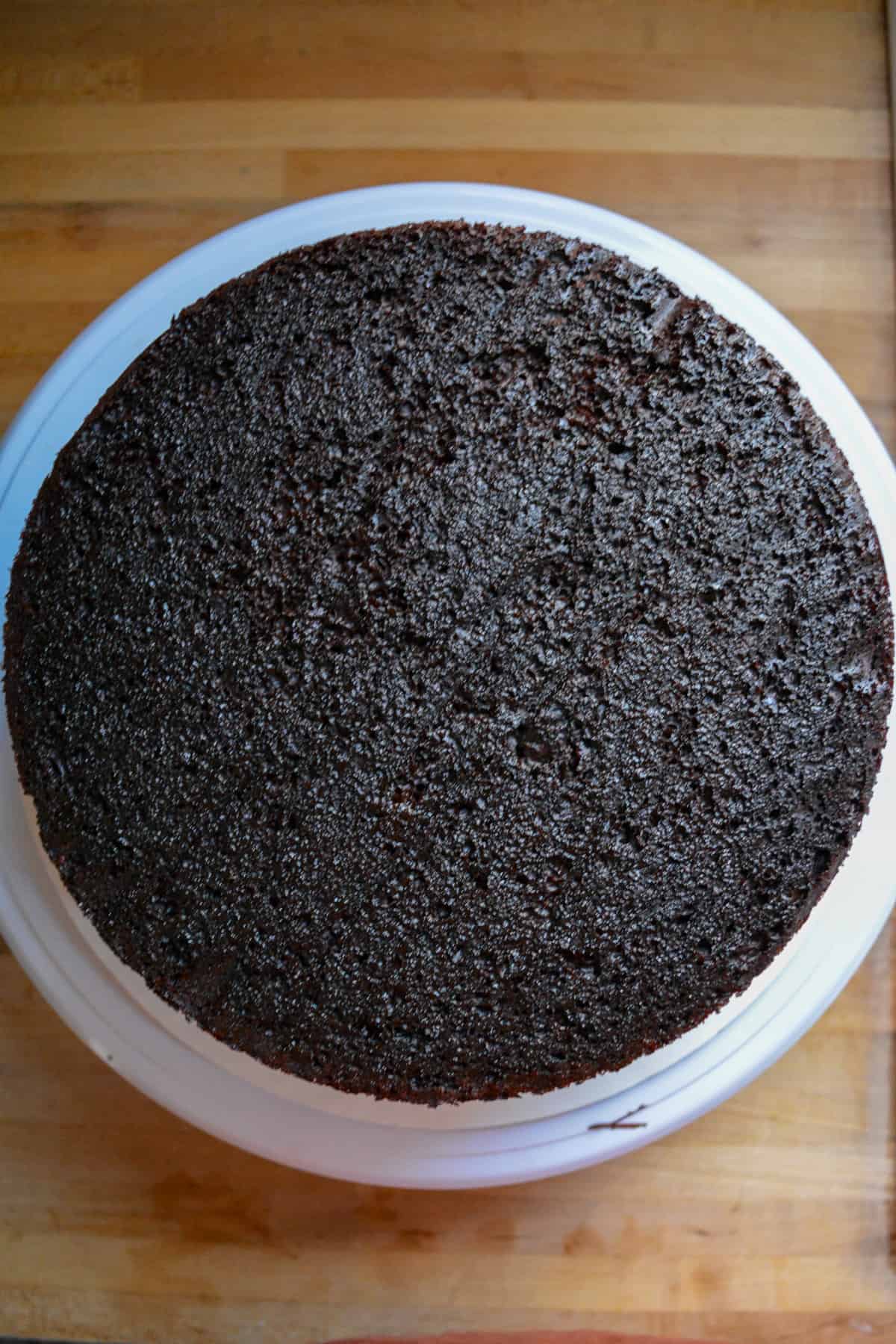 Another chocolate cake layer added to the top of the fudge layer.