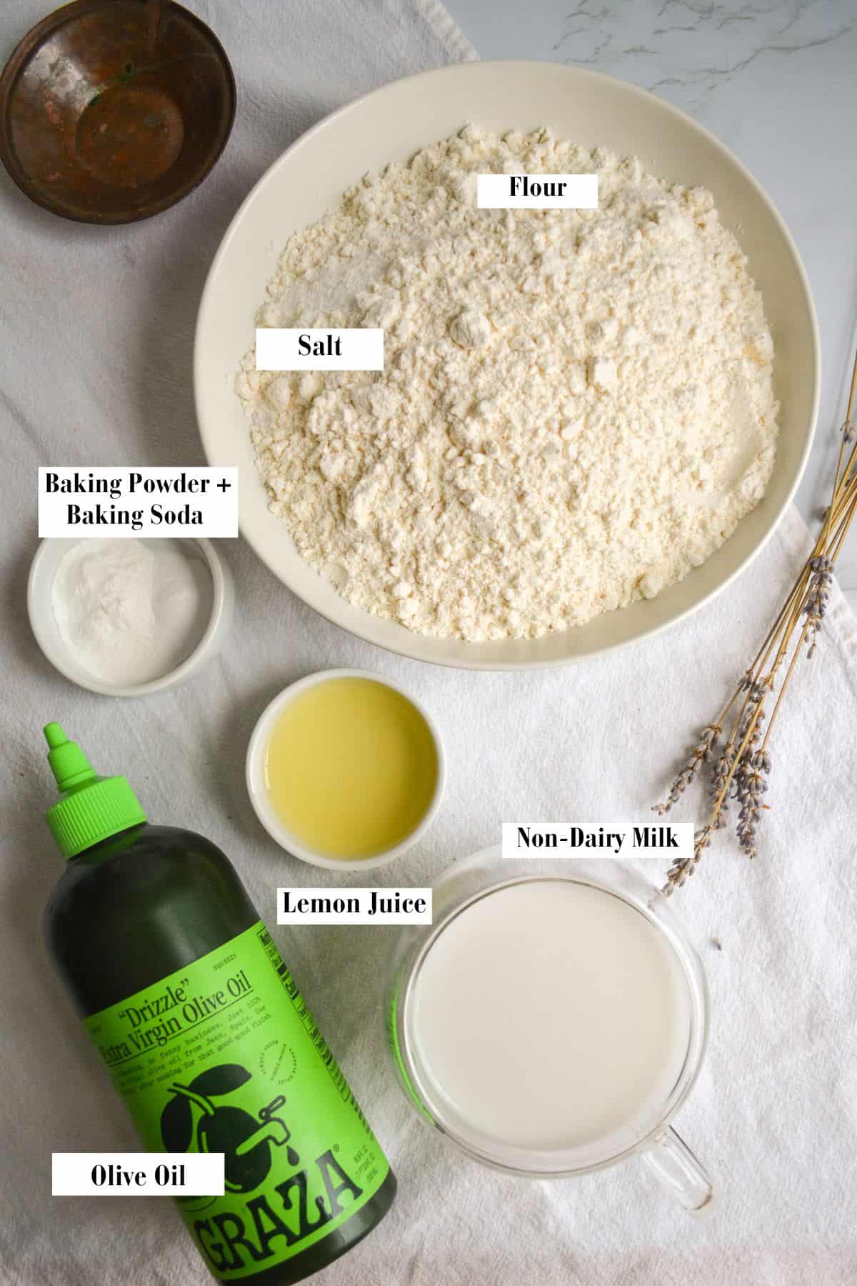 Ingredients for making vegan Irish soda bread on a white cloth.