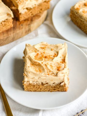Vegan Biscoff Cake with biscoff buttercream on a small plate.