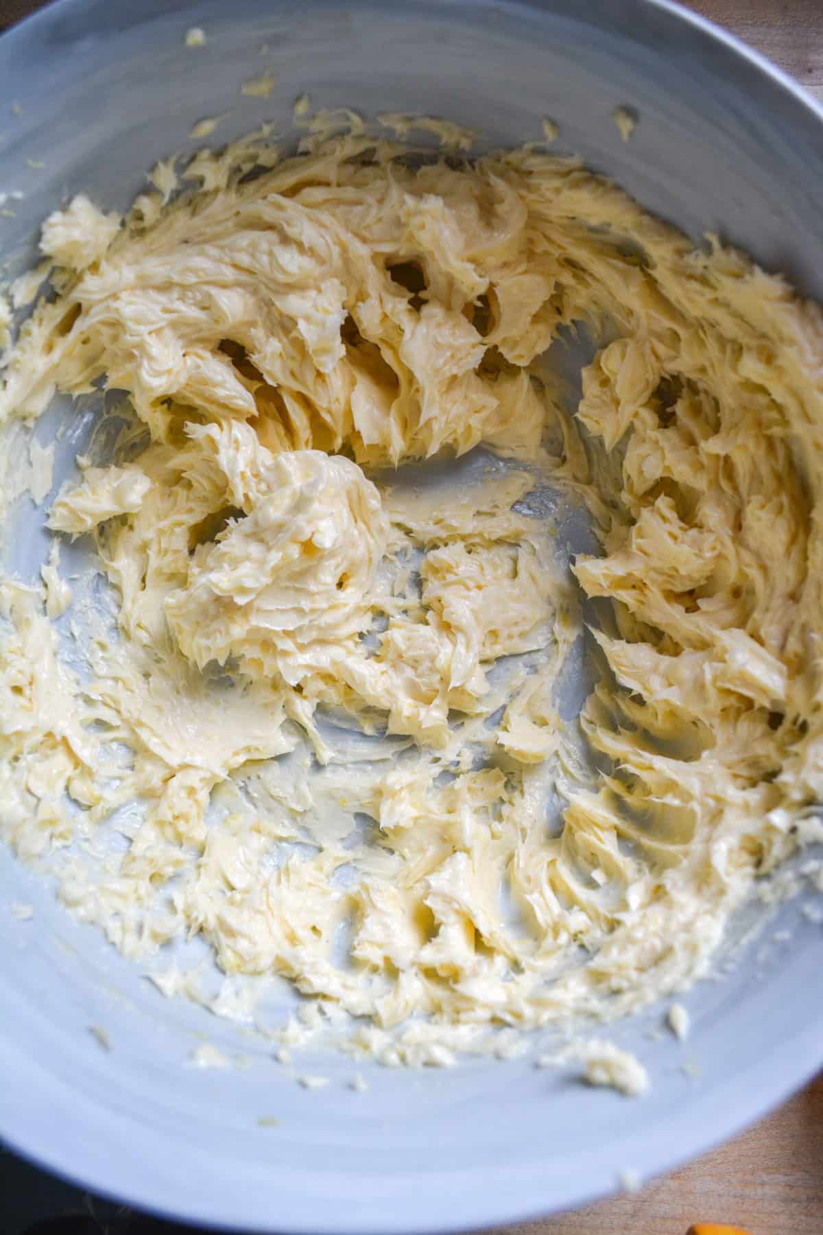 Vegan butter and lemon zest creamed together in a large bowl.