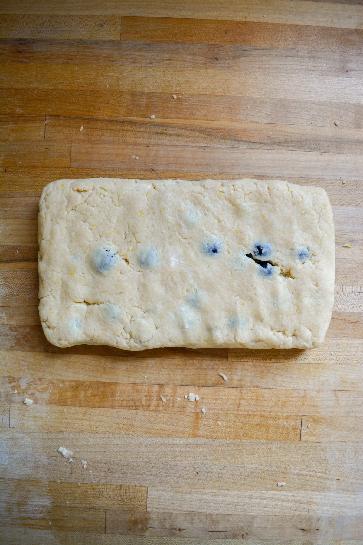 Vegan Blueberry scone dough pressed into a rectangle.