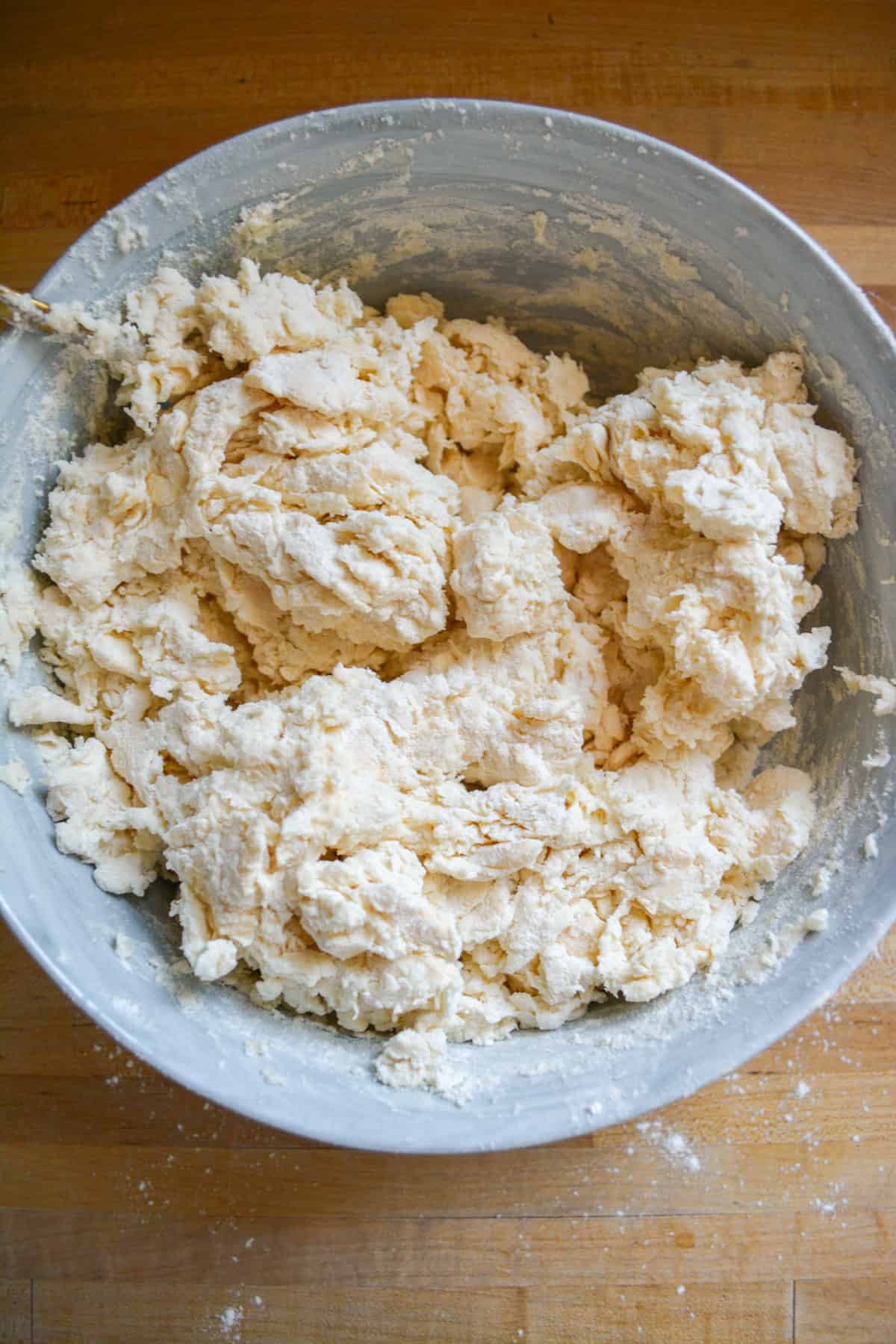 Shaggy Vegan and Dairy Free Buttermilk Biscuit dough in a large bowl.