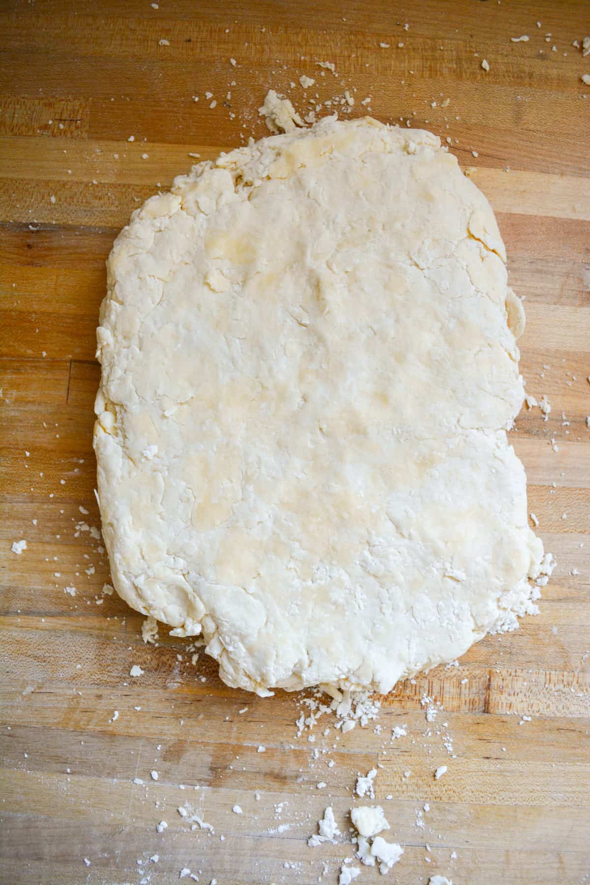 Vegan Buttermilk Biscuit Dough Pressed into a rough rectangle to cut out.