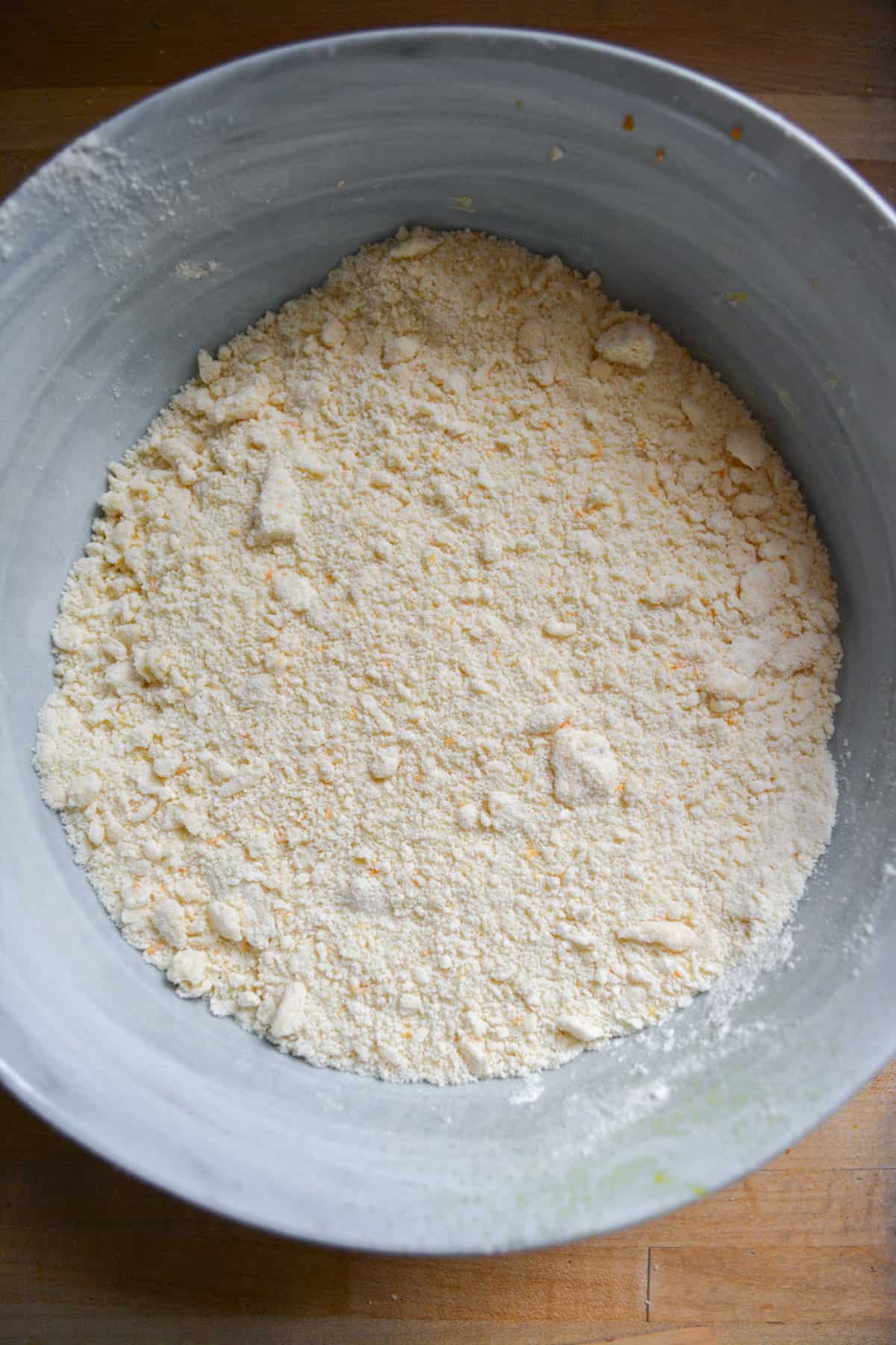Vegan butter cut into the dry ingredients in a large mixing bowl.