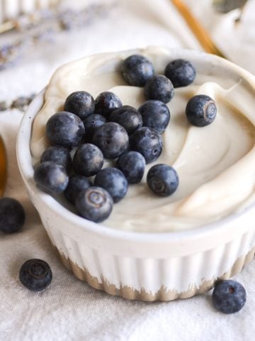Vegan Dairy Free Pastry Cream Custard in a ramekin topped with blueberries.