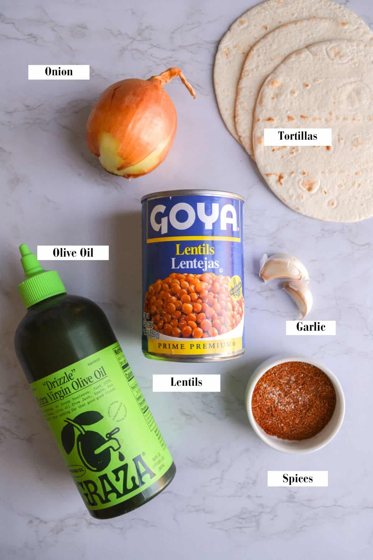 Ingredients for vegan lentil tacos on a marble surface.