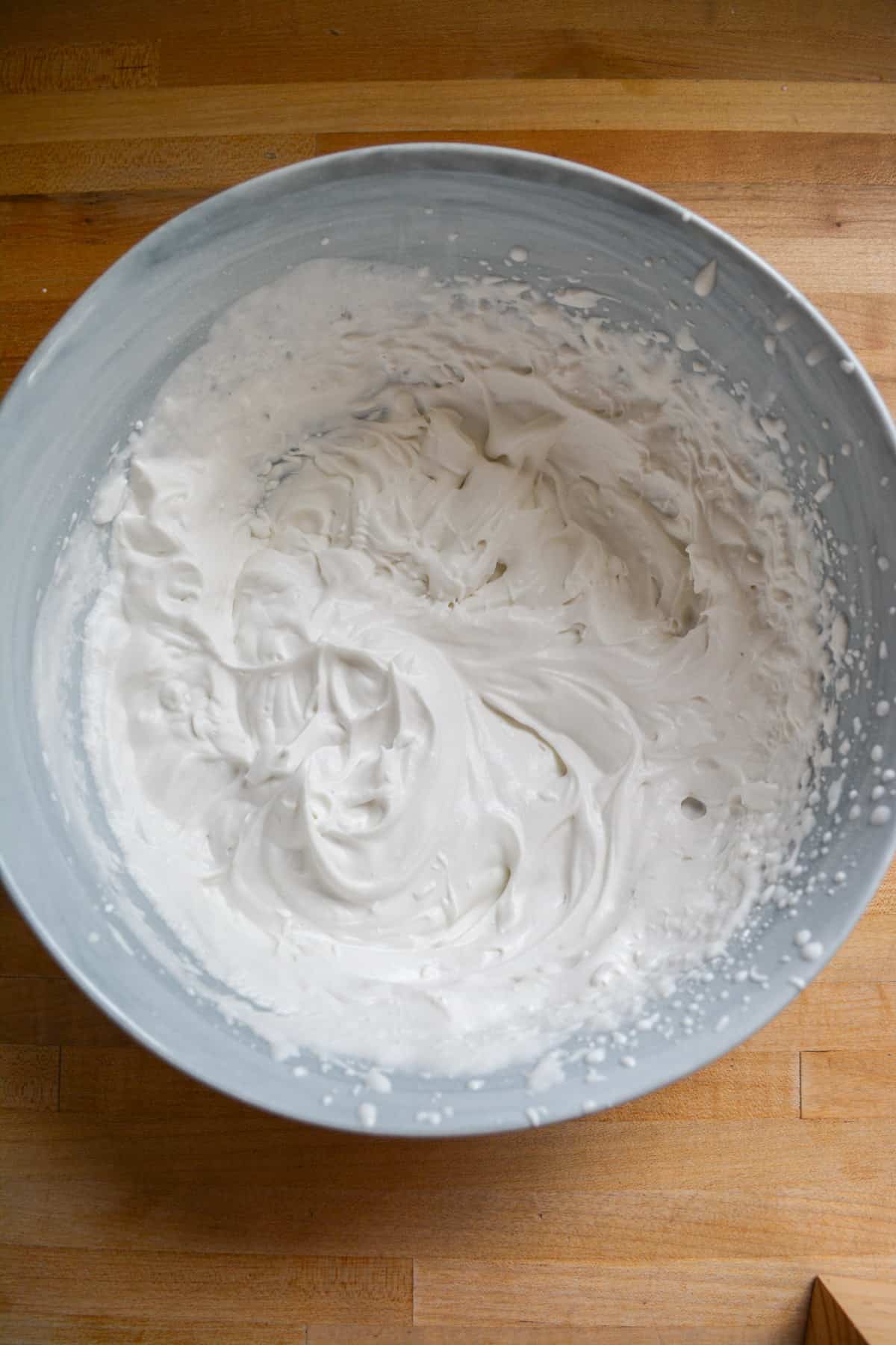 Whipped vegan cream in a mixing bowl.