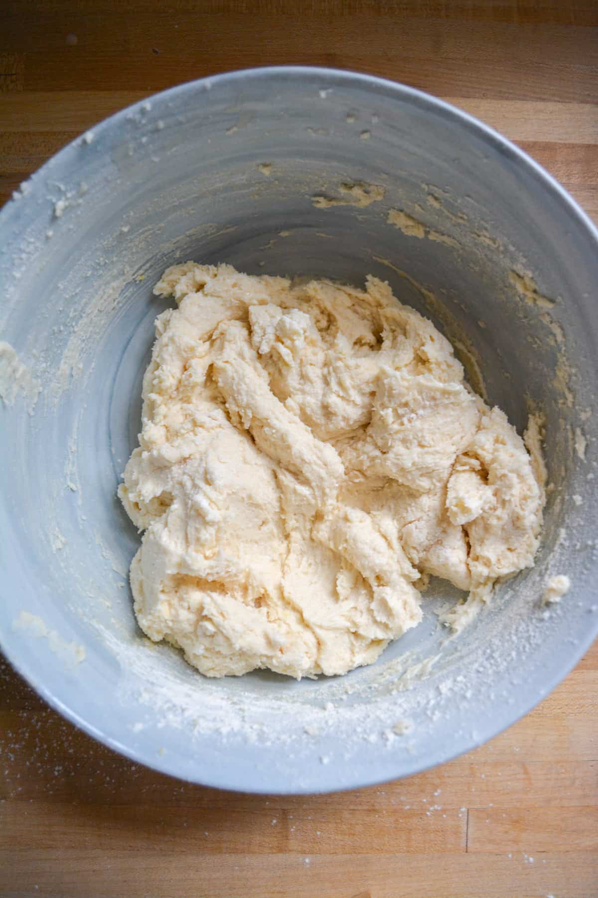 Half of the dry ingredients mixed into the cake batter mixture.