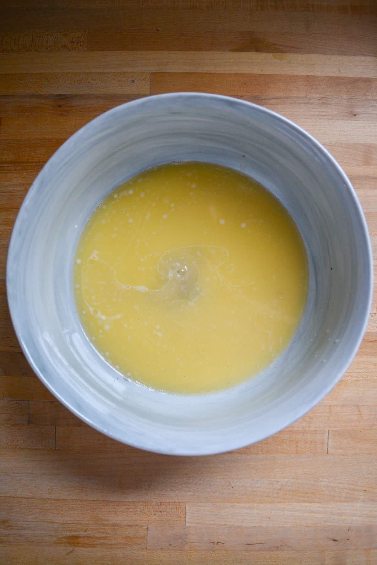 Non-dairy milk, sugar, vanilla extract and butter in a large mixing bowl.